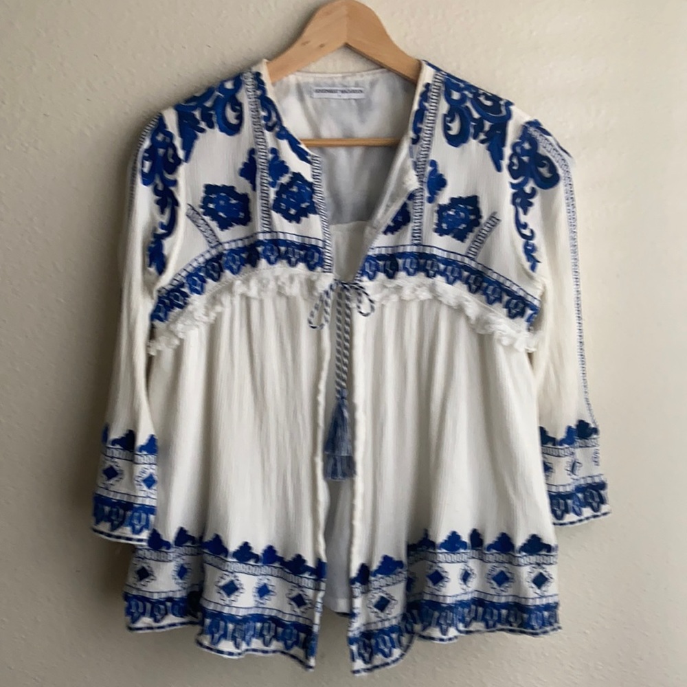 Anthropologie white cardigan with beautiful blue embroidery. Gently worn.